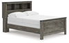 Cama con panel y librería Frandern
