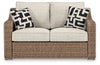 Loveseat de exterior Beachcroft con cojín